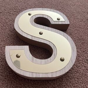 Gold “S” decoration